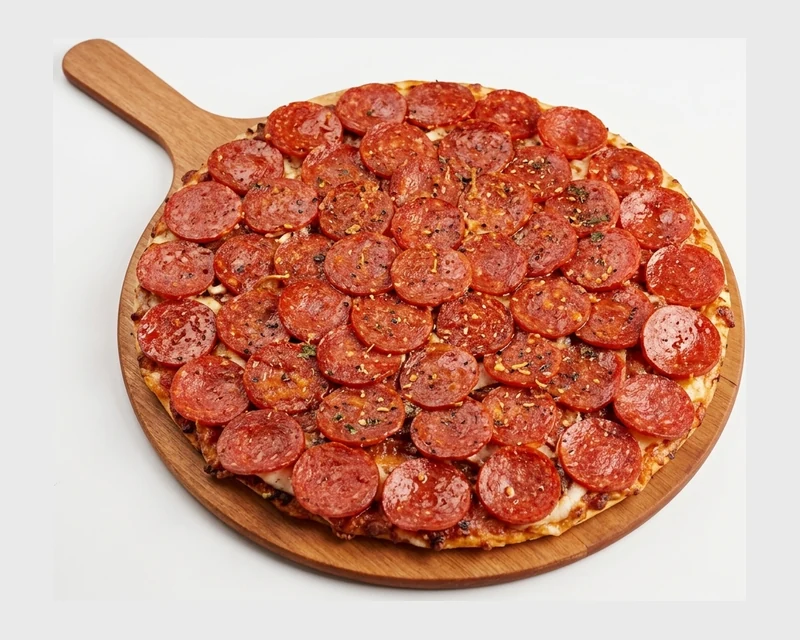 Monster Pepperoni Pizza with double cheese on a green tea crust at Pizza Maru & Katsuya West, West Springs, Calgary